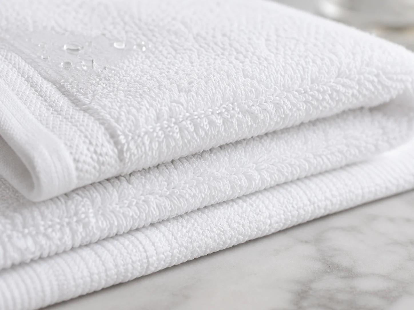 Close-up of hotel towel terry loops showing GSM and thickness
