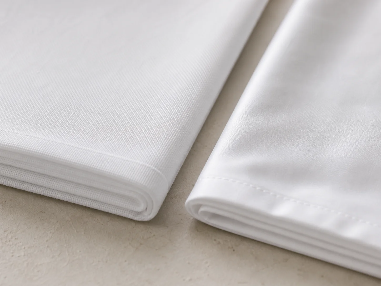 Close-up comparison of percale and sateen hotel sheet weave textures