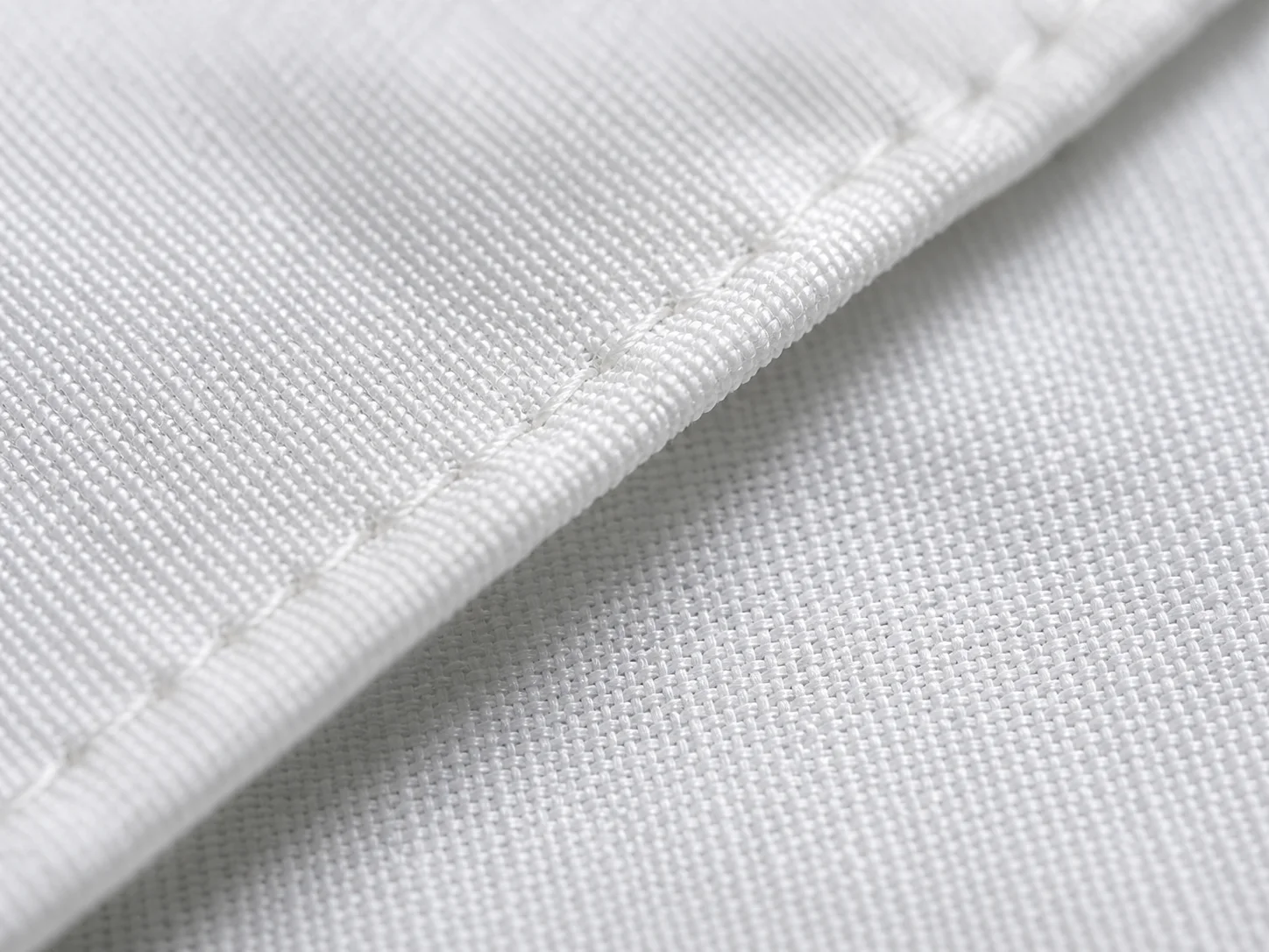 Close-up of hotel sheet weave showing cotton fabric quality