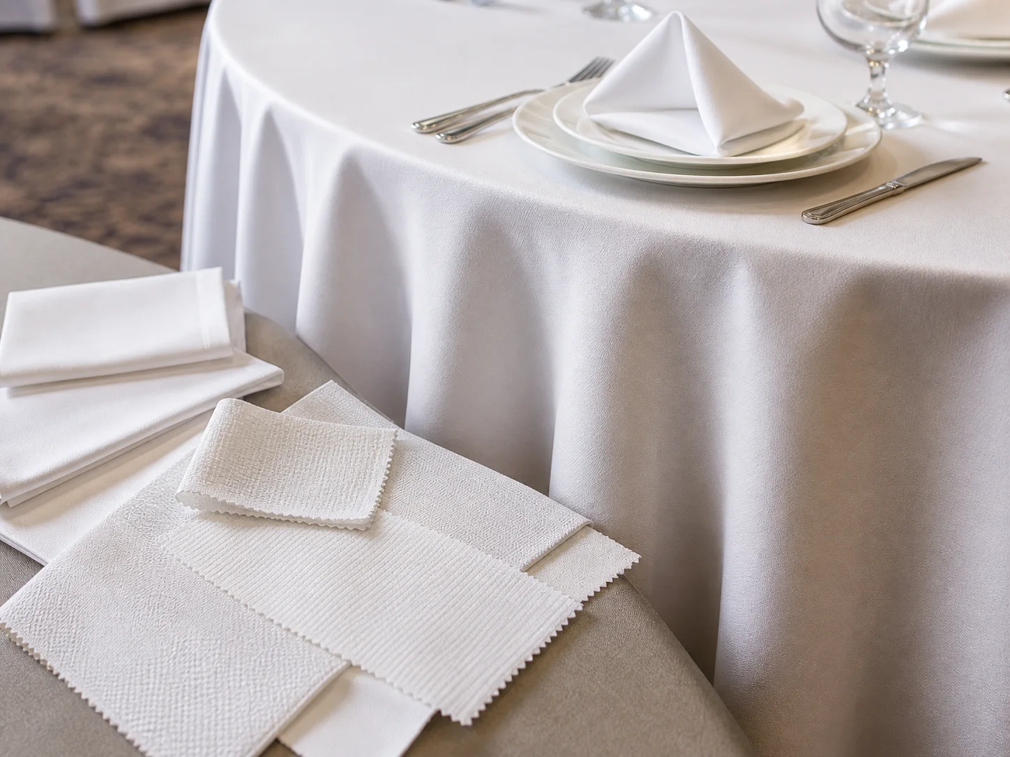 Hotel tablecloth drop and fabric detail on a banquet table