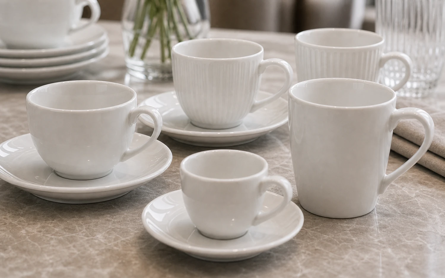 Close-up of white porcelain cup profile and saucer detail